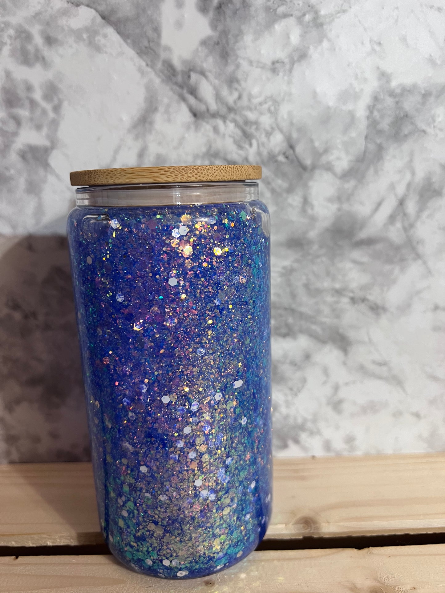 Shimmer blue glitter snow globe